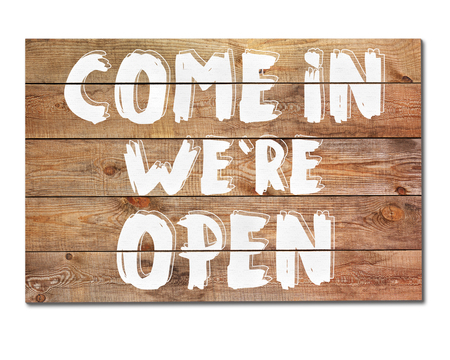 Vintage Come in we are open sign isolated on white background. Closeup.の写真素材