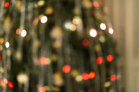 Festive abstract circular background with bokeh defocused Christmas lights and stars.の写真素材