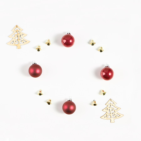 Festive composition of Christmas decorations on white background. Flat lay with copy space. New year holiday frame.の写真素材