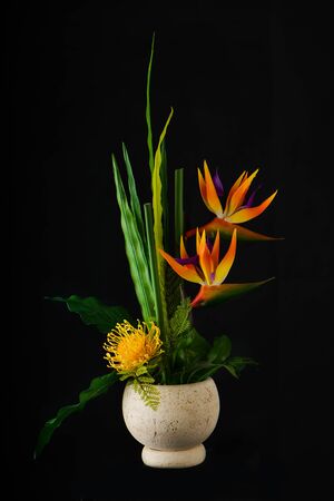 Flower arrangement of flowers on dark background.の写真素材
