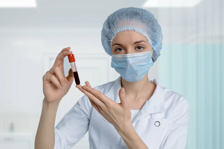 Scientist holds blood sample for Coronavirus testing in laboratory. MERS China Wuhanの写真素材
