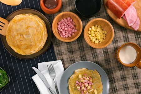 Pancake week breakfast. Homemade holiday meal in the morning with ham and cheese.の写真素材