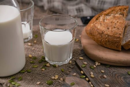 Breakfast in the country with milk and whole wheat bread. Morning meal on the first of June.の写真素材