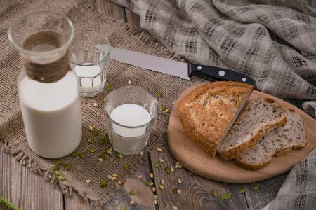 Breakfast in the country with milk and whole wheat bread.の写真素材