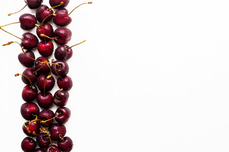 Cherries isolated on white background with copy space for text.の写真素材