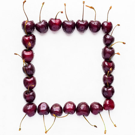 Cherries frame isolated on white background. Flat lay, top view.の写真素材