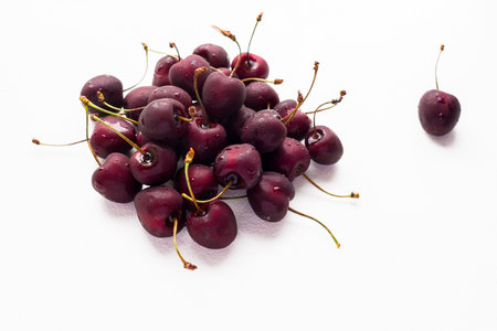 Cherries with water drops on a white background, isolated.の写真素材