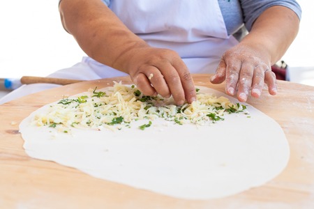 Pita bread with cottage cheese and greensの写真素材