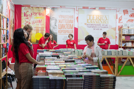 LVIV, UKRAINE - SEPTEMBER 19, 2018: Book sellers and shoppers among book stalls at the 25th Lviv International Book Fairのeditorial素材