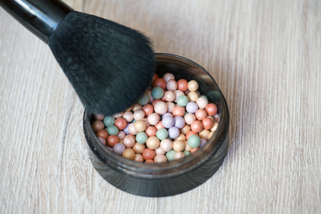 Multicoloured corrector face powder balls for make up. Powder Brush. Top view
