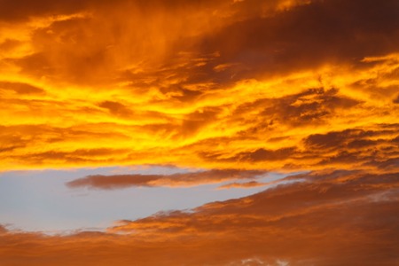 Fiery orange sunset sky. Beautiful sky. Fluffy duskの写真素材