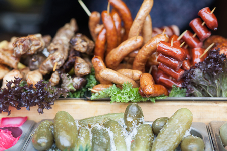 Different kinds of grilled sausages. Delicious food.の写真素材