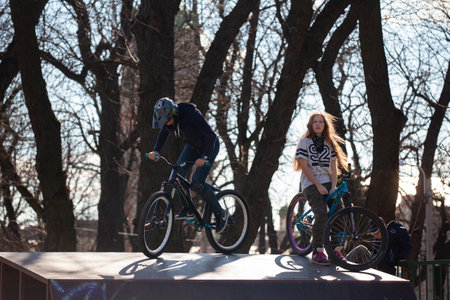 Lviv, Ukraine - March 12, 2020: BMX in the city skatepark. A group of teens on Bmx bikes in a skate park. Extreme sports is very popular among youth.のeditorial素材