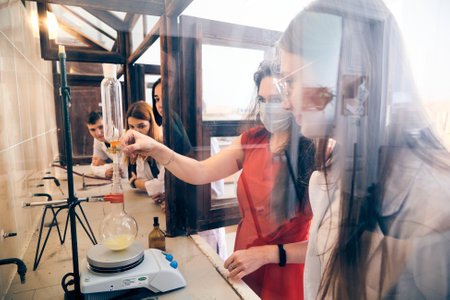 Lviv, Ukraine - August 26, 2020: Young Science Students Doing An Experiment. Chemicals and laboratory utensils.のeditorial素材