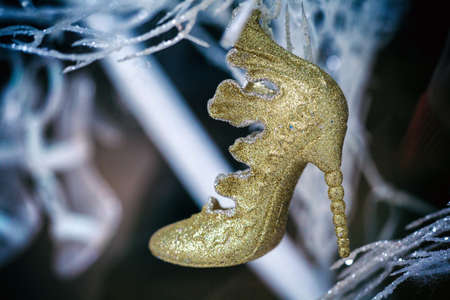 Shoe Christmas Ornament. Christmas decoration hanging on a Christmas tree. Shallow depth of fieldの写真素材