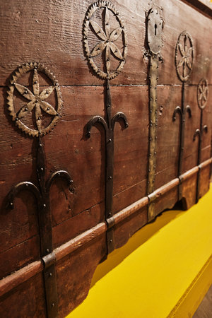 Fragment of the Large Antique Wooden Chest. Large wooden box for clothes. Forged detailsの写真素材