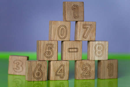 Arithmetic, mathematic, learning concept, numbers background with wooden cubes. Shallow Depth of Fieldの写真素材