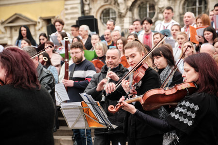 Lviv, Ukraine - March 16, 2022: Symphony Orchestra performed on Market Square in Lviv as part of the...