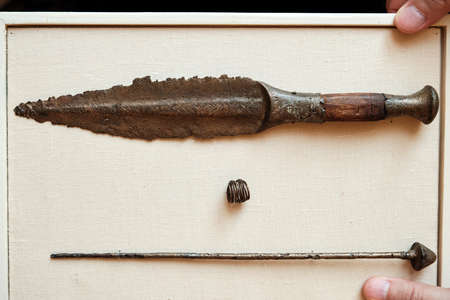 Bronze dagger, pendant, pin. Accompanying inventory from burial. Trzciniec-Komariv culture.の写真素材