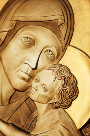 Relief scupture of Madonna and Child. Depiction of the Virgin Mary holding the Child Jesus. Virgin Hodegetria. Modern Art.の写真素材