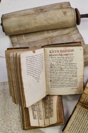 LVIV, UKRAINE - April 2, 2020: Still life with ancient books. Old religious Slavonic books with...