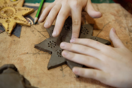 Kids are taking a ceramics class. Every Saturday, the children are eager to go to their ceramics class and create pottery. Children's leisureの写真素材