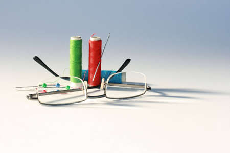 Glasses, thread and needles