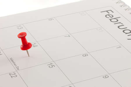 A red pin in Valentines Day on a calendarの写真素材