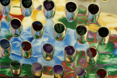 Colourful reflections in a cheese grater in close upの写真素材
