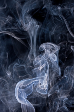 Smoke or Steam Rising against a Black Backgroundの写真素材