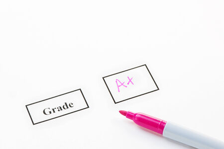 Grade A+ on paper with a felt penの写真素材