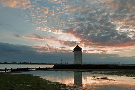 Historic coastal lookout tower on the coast in the UK. Seen at sunset.の写真素材
