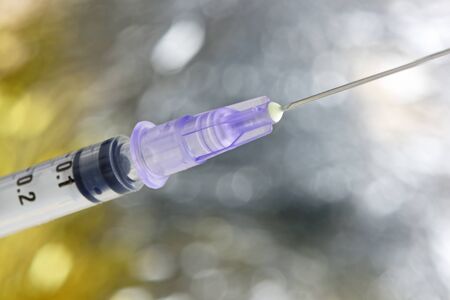 Close up of a hypodermic syringe and needle. Shallow d o f. Health and medical concept.の写真素材
