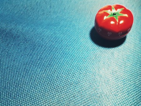 Tomato formate - pomodoro timer at the center of a backgroud.の写真素材