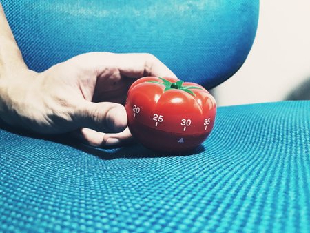 Tomato formate - pomodoro timer at the center of a backgroud.の写真素材