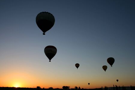 Hot Air Balloons lifting off at dawnの写真素材