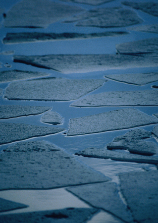 Broken chunks of Ice on a canal in Birminghamの写真素材