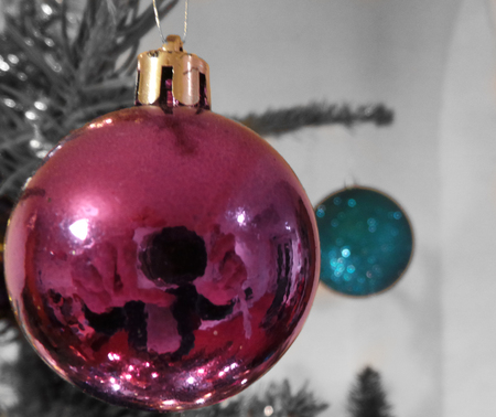 Christmas Baubles hanging from a treeの写真素材