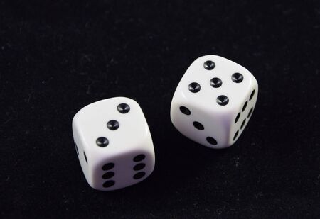 A pair white of dice showing Five and Threeの写真素材