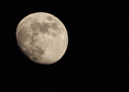 Photo of a Three Quarter moon at night