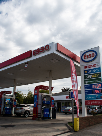 Henley, United Kingdom - September 16 2018:   The Forecourt of the Esso petrol Station on Reading Road, incorporating a Spar supermarket, Subway, Greggs and Starbucksのeditorial素材