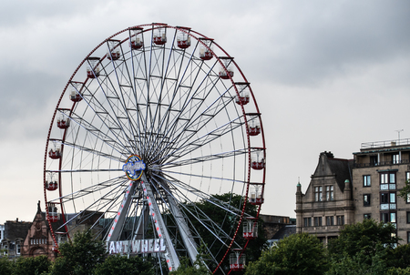 Edinburgh, United Kingdom - August 10 2018:   The Edinburgh giant wheel in East Princes Street Garden on a grey dayのeditorial素材