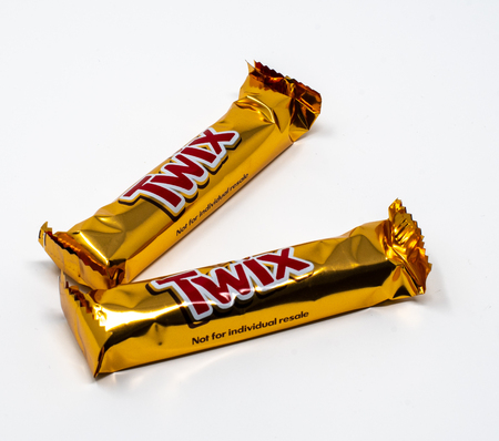 Reading, United Kingdom - September 29 2018:   A pair of individually wrapped Twix chocolate fingersのeditorial素材