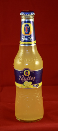 Reading, United Kingdom - May 02 2015:   A bottle of Fosters Radler, a lager shandy made with cloudy lemonade by Australian Brewery Fostersのeditorial素材