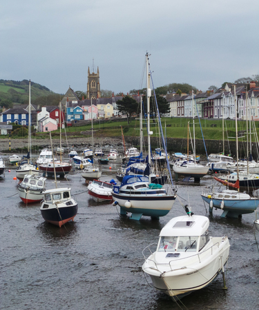 Aberaeron, United Kingdom - May 29 2013:   Boats resting on the beach at low tideのeditorial素材
