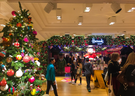 London, United Kingdom - September 20 2015:   Shoppers in the Christmas Department of the world famous Harrods department storeのeditorial素材