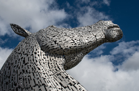 Falkirk, United Kingdom - August 09 2018: A view of one of the Kelpies - a pair of large horse head statues made from Stainless steel by Sculptor Andy Scott and unveiled in 2013のeditorial素材