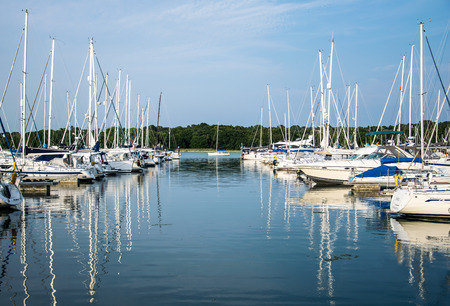 Hamble-le-Rice, United Kingdom - July 21 2018:   A Small yacht sits at the end of the entrance to...