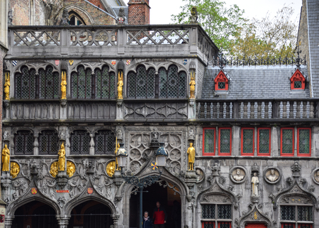 Bruges, Belgium - April 28 2018:   Detail of the Basilica of the Holy blood church, a beautiful Gothic Building with gold statues in Burgのeditorial素材