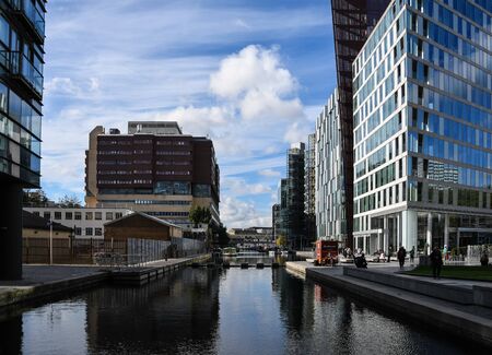 London, United Kingdom - October 18 2018:   Modern office blocks surround the water of Paddington Basin just behind Praed Streetのeditorial素材